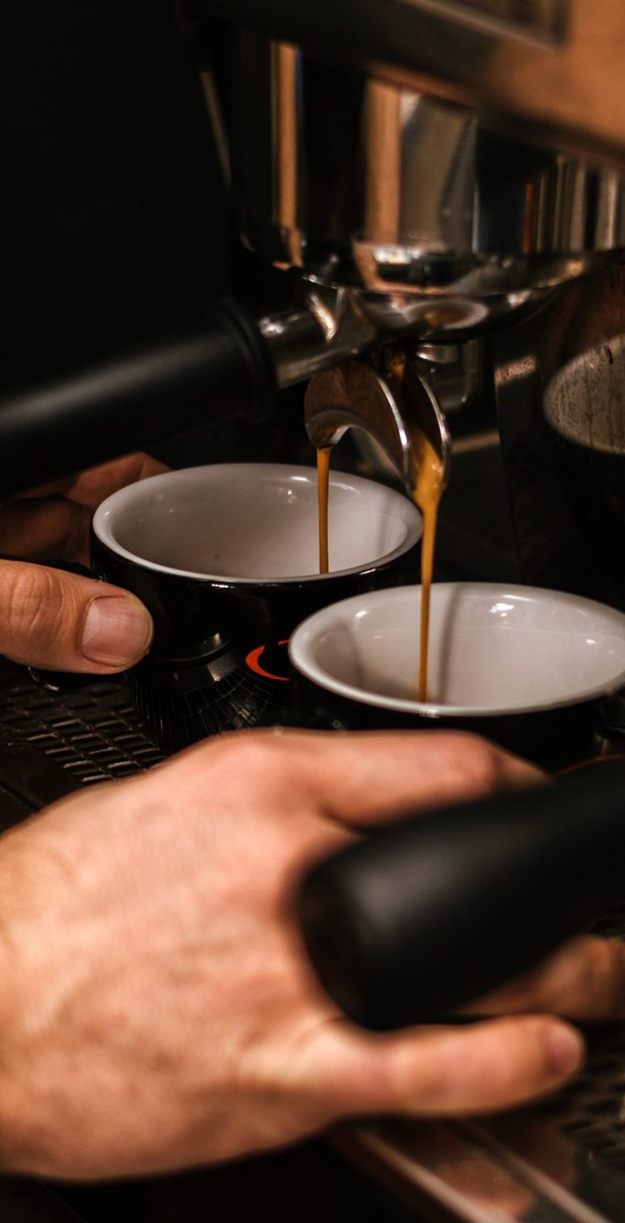 Barista hands while making a cup of coffee
